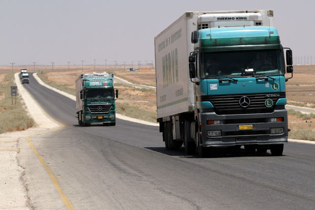 This photo taken in May of last year shows trucks entering Jordan from Iraq   (Photo by Raad Adayleh)
