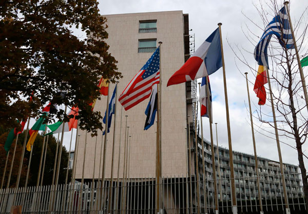 This photo taken on Thursday shows the flags flying in front of the United Nations Educational, Scientific and Cultural Organisation headquarters in Paris (AFP photo)