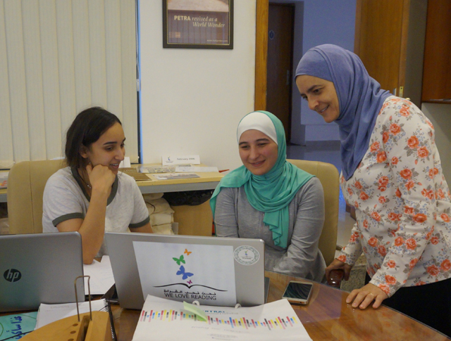 Rana Dajani, who developed the 'We Love Reading' programme with her family in 2006, is seen with volunteers  (Photo courtesy of UNESCO)