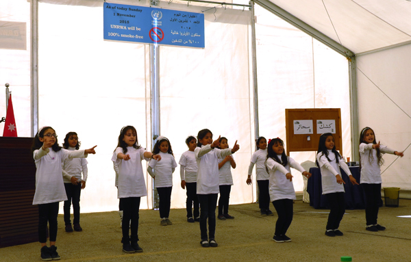 Students from an UNRWA school perform a song against smoking at an event held by the UN agency in Amman on Sunday (Photo by Xiomara Hurni-Cranston)
