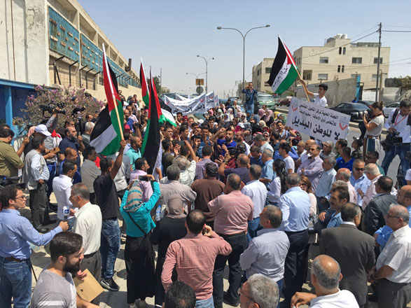Protestors stage a sit-in outside UNRWA premises in Amman on Sunday  (Photo by Muath Freij)