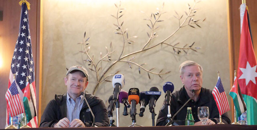 Senators Lindsey Graham (right) and Christopher Coons speak to reporters at a press conference in Amman on Tuesday (Photo by Osama Aqarbeh)