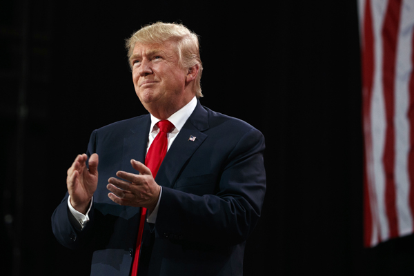 Republican presidential candidate Donald Trump arrives to speak to a campaign rally, on Monday, in Tampa, Florida (AP photo)