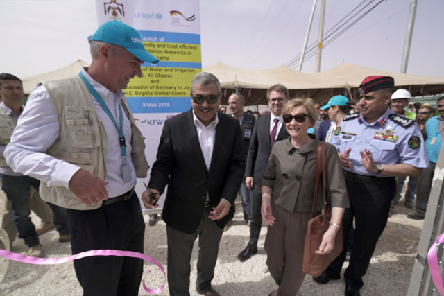 From left to right: UNICEF representative, minister of water and irrigation and German ambassador launch the water supply and waste water network in Zaatari camp on Thursday (Photo courtesy of UNICEF)