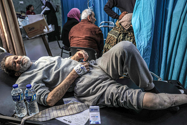 A man, who was detained with other Palestinians by the Israeli military during their operation in the northern Gaza Strip and recently released through the Karem Abu Salem crossing, awaits treatment for his injuries at Al Najjar hospital in Rafah in the southern Gaza Strip on Sunday (AFP photo)