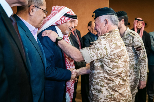 His Majesty King Abdullah meets with a group of retired servicemen and women, during a meeting at the Royal Hashemite Court to mark Veterans Day, attended by HRH Crown Prince Hussein, on Wednesday (Photo courtesy of Royal Court)
