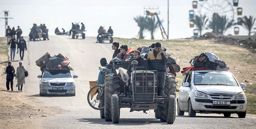 Palestinian families fleeing Khan Yunis on the coastal road leading to Rafah further south drive along the sea with their belongings on their cars on Thursday (AFP photo)