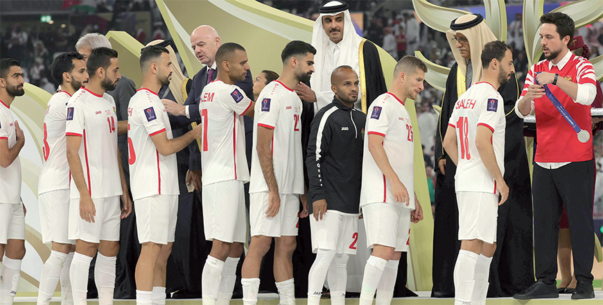 HRH Crown Prince Hussein awards silver medals to Jordanian national football team's players during the podium ceremony after the AFC Qatar 2023 Asian Cup final football match between Jordan and Qatar at the Lusail Stadium in Lusail, north of Doha on Saturday (AFP photo)