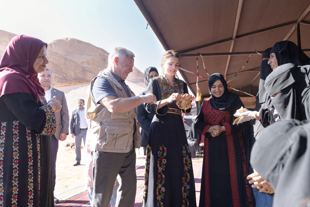 His Majesty King Abdullah, accompanied by Her Majesty Queen Rania, visits the Disi Women's Cooperative Association on Sunday (Photo courtesy of Royal Court)