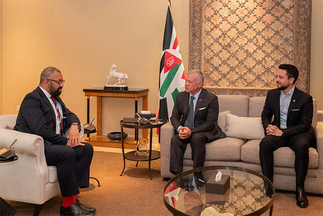 His Majesty King Abdullah receives UK Secretary of State for Foreign, Commonwealth and Development Affairs James Cleverly, at a meeting attended by HRH Crown Prince Hussein, on Thursday (Photo courtesy of Royal Court)