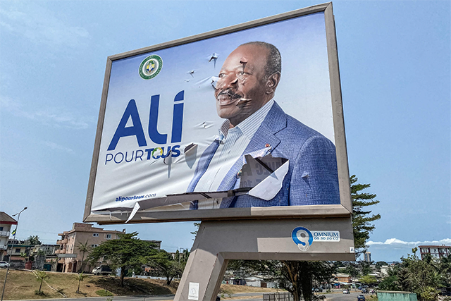 A general view of a torn campaign billboard of ousted Gabon President Ali Bongo Ondimba in Libreville on Thursday (AFP photo)
