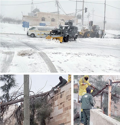 Top: A snow sweeper removes snow from a street in Ajloun, some 70 kilometres northwest of Amman, on Wednesday Below: Personnel from the Greater Amman Municipality remove a fallen tree from a building in Amman on Wednesday (Petra photos)