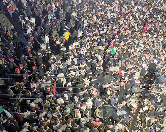 Jordanians protest in the vicinity of the Israeli embassy in Amman following an Israeli air strike on a Gaza hospital compound killing hundreds on Wednesday  (Photo by Osama Aqarbeh)