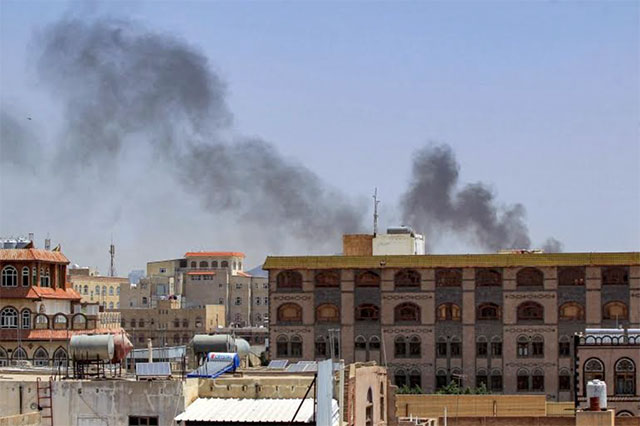 Smoke rises in Sanaa amid reports that the Saudi Arabia-led coalition struck a Houthi armoured division (AFP photo)