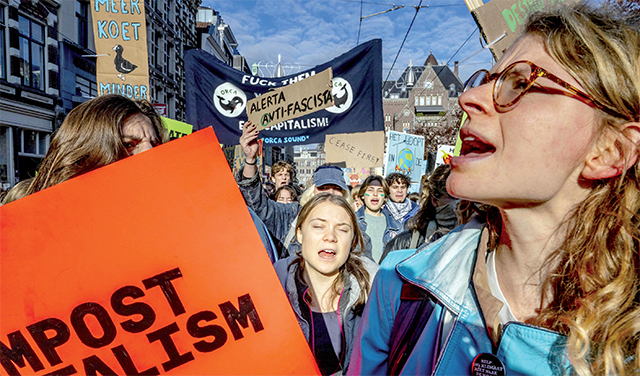 Climate activists, including Swedish climate activist Greta Thunberg march during a rally for climate and justice, in Amsterdam, on Sunday. (AFP photo)