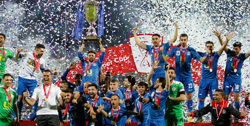 Ramtha players and club officials celebrate winning the Jordan Super Cup against Faisali late Tuesday in Amman (Photo courtesy of Jordan Football Association)