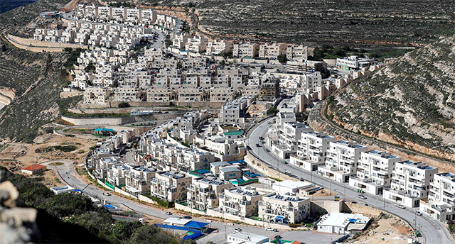 This file photo taken on January 21 shows ongoing construction work in the Israeli settlement of Givat Zeev, near the Palestinian city of Ramallah in the occupied West Bank (AFP photo)