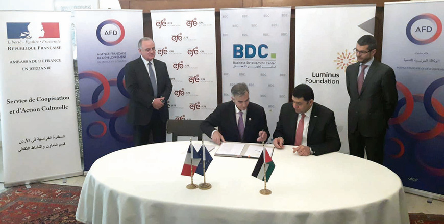 Labour Minister Samir Murad and French Ambassador David Bertolotti take part in the signing ceremony at the French ambassador's residence on Tuesday (Photo by Camille Dupire)
