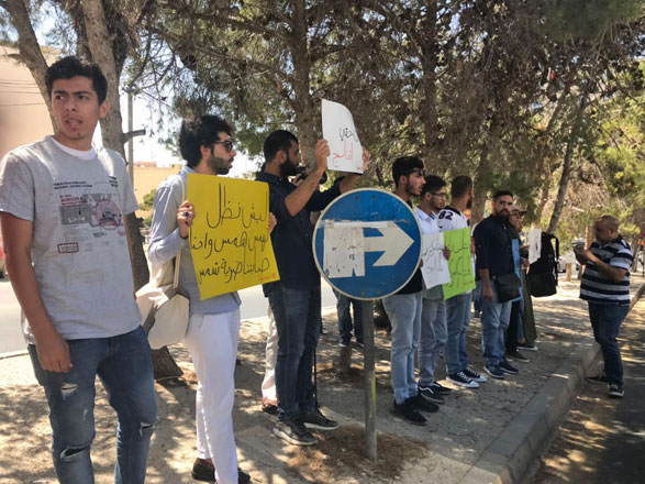 Students carrying banners stress their right to healthcare at Al al Bayt University on Thursday (Photo courtesy of The National Campaign for Students’ Rights - Thabahtoona)
