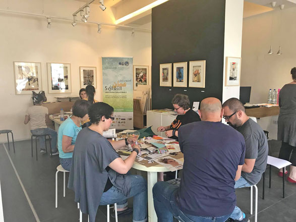 Art enthusiasts take part in a free collage workshop at Jacaranda Images in Jabal Amman on Saturday  (Photo courtesy of Jacaranda Images)