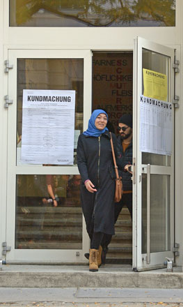 A woman wearing a headscarf leaves a polling station during general elections in Vienna, Austria, on Sunday (AFP photo)