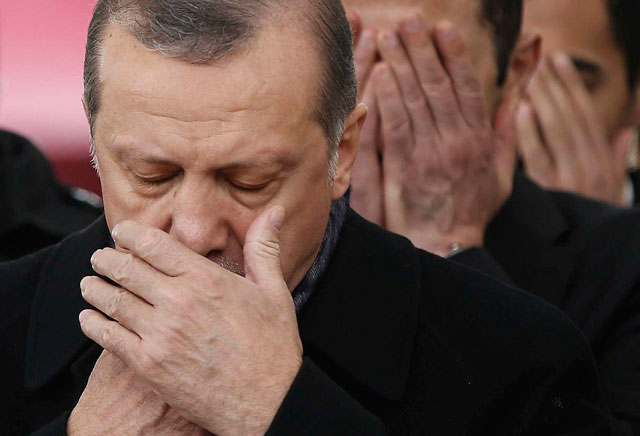 Turkey’s President Recep Tayyip Erdogan attends the funeral prayers for police officer Hasim Usta, who was killed with dozens of  others late Saturday outside the Besiktas football club stadium Vodafone Arena, in Istanbul on Monday (AP photo)