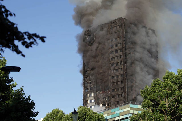 Smoke billows from Grenfell Tower as firefighters attempt to control a huge blaze on Wednesday in west London (AFP photo)