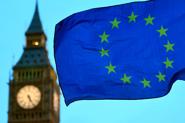 This file photo taken on February 20 shows a European Union flag flying in front of Elizabeth Tower, otherwise known as Big Ben, as an anti-Trump protest gets under way in London (AFP photo)
