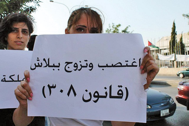 In this undated file photo, young women protest against Article 308 of the Penal Code. The placard says: ‘Rape and marry for free’  (File photo)