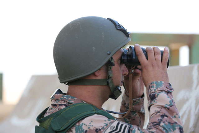 A soldier is on duty on Saturday at a border military post with Syria as regime forces regain control of the Syria side of the crossing (Photo by Raad Adaileh) 