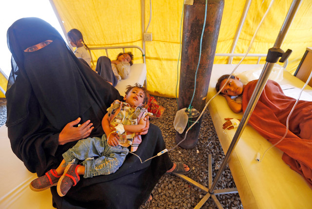 Yemeni children suspected of being infected with cholera receive treatment at a makeshift hospital in Sanaa on Monday (AFP photo)