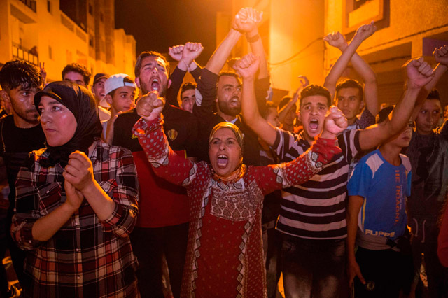 Protesters stand off before police during a demonstration against corruption, repression and unemployment in Al Hoseima, Morocco, on Saturday (AFP photo)