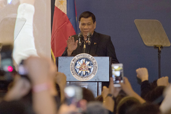 Philippine President Rodrigo Duterte addresses members of the Philippine community in Beijing, China, on Wednesday (AP photo)