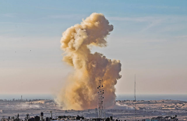This photo taken on Tuesday from Rafah in the southern Gaza Strip shows smoke billowing following an explosion close to the border on the Egyptian side of the divided city (AFP photo)