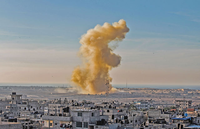 This photo taken on Tuesday from Rafah in the southern Gaza Strip shows smoke billows following an explosion close to the border on the Egyptian side of the divided city (AFP photo)