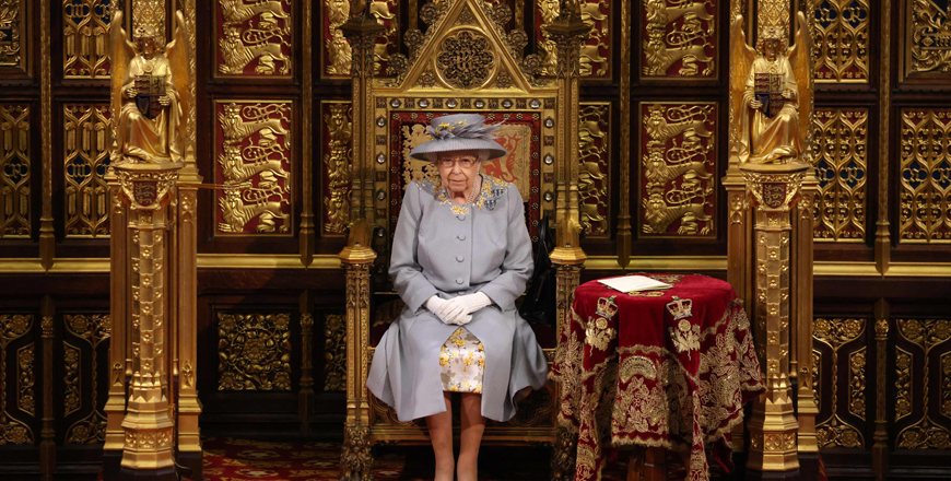 In this file photo taken on May 11, 2021 Britain's Queen Elizabeth II sits on the The Sovereign's Throne in the House of Lords chamber during the State Opening of Parliament at the Houses of Parliament in London, which is taking place with a reduced capacity due to Covid-19 restrictions.