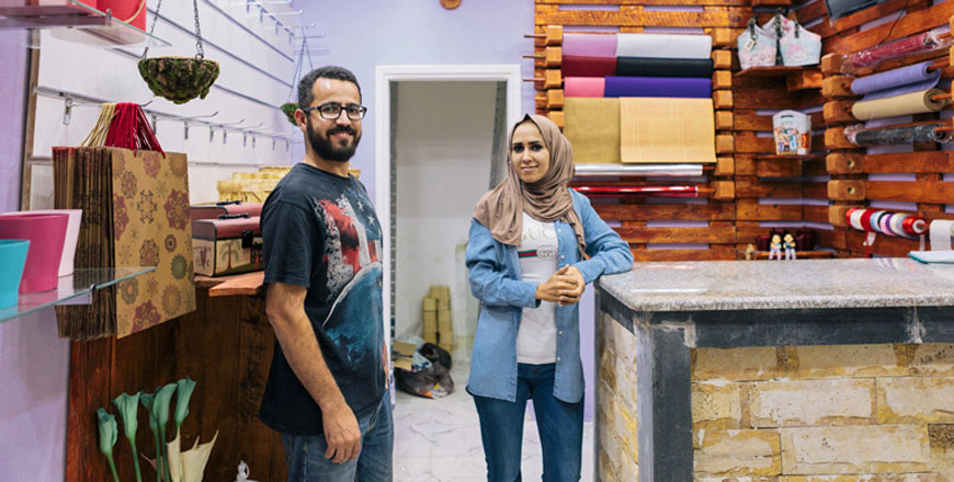 Jordanian friends Asmaa and Hussam, who are both deaf, developed an app using pictures and sign language to sell their flower shop products (Photo courtesy of FCA)