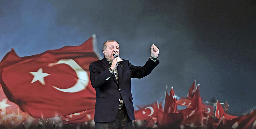 Turkish President Recep Tayyip Erdogan gestures as he delivers a speech on stage on Sunday in Istanbul during a pro-government women meeting (AFP photo)