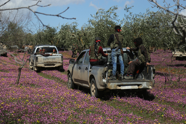 Members of Free Syrian Army (FSA) control the area after Turkish armed forces and FSA members cleared from PYD/PKK-Daesh terrorists within the ‘Operation Olive Branch’ in northeastern Afrin, Syria, on Saturday (Anadolu Agency)