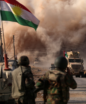 Smoke rises during clashes between peshmerga forces and the Daesh terror group militants in the town of Bashiqa, east of Mosul, during an operation to attack the group in Mosul, Iraq, on Monday (Reuters photo)