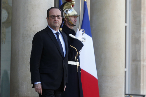 France’s President Francois Hollande waits his Namibian counterpart Hage Geingob, prior to a meeting at the Elysee Palace, in Paris, on Monday (AP photo)