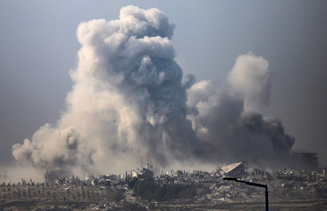 This photo, taken from southern Israel near the border with the Gaza Strip, shows smoke billowing after an Israeli strike in the Palestinian territory on Monday (AFP photo)