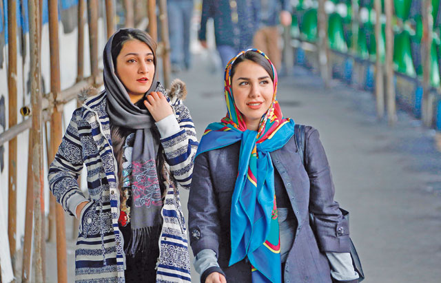 Iranian women wearing hijab walk down a street in the capital Tehran, on Wednesday (AFP photo)