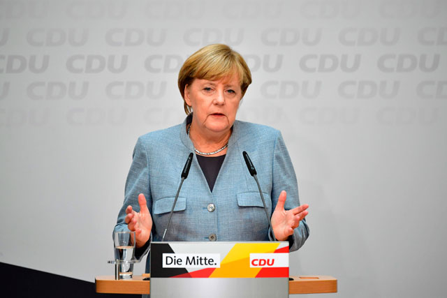 German Chancellor Angela Merkel attends a press conference at the headquarters of the Christian Democratic Union Party in Berlin on Monday, one day after general elections (AFP photo)