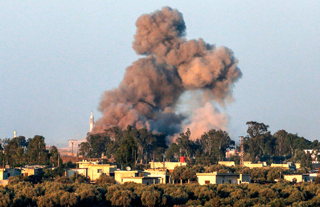 This photo taken on Monday from the Israeli-occupied Golan Heights shows a smoke plume rising during air strikes backing a Syrian government-led offensive in the southwestern province of Daraa (AFP photo)