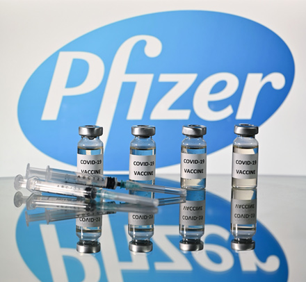 In this file photo taken on November 17, 2020 an illustration picture shows vials with COVID-19 Vaccine stickers attached and syringes with the logo of US pharmaceutical company Pfizer, on November 17 (AFP photo)