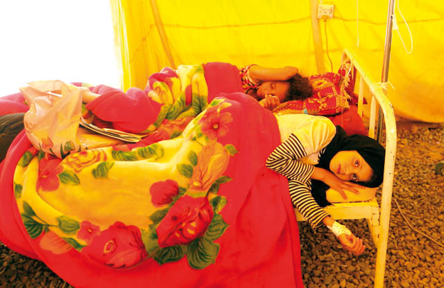 Yemeni children infected with cholera receive treatment at Sabaeen Hospital in Sanaa, on Tuesday (AFP photo)