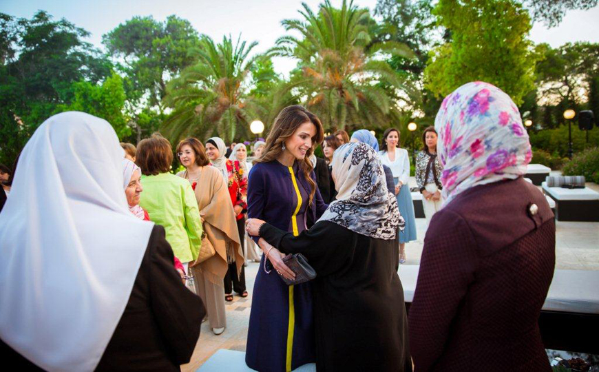 Her Majesty Queen Rania speaks to one of the guests at an iftar banquet she hosted Sunday at the Raghadan Palace (Photo courtesy of Royal Court)