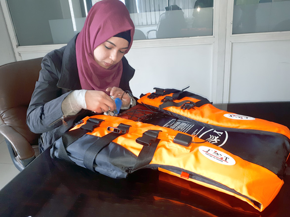 Young Siba Obaid works on the prototype of her smart life jacket in Amman recently  (Photo by Renad Aljadid)