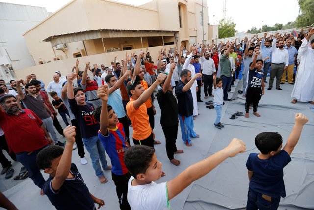 Supporters chant religious slogans during a sit-in in the village of Diraz, west of Manama, Bahrain, on Tuesday (Reuters photo)